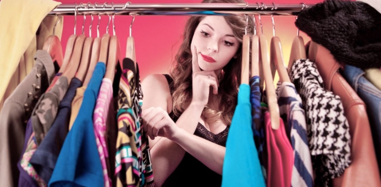 A woman considering her clothing options – comparing fast fashion with wardrobe longevity"